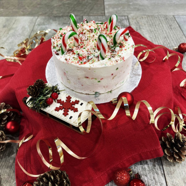 Candy Cane ice cream cake filled with a minty Candy Cane ice cream and decorated beautifully with Candy Cane dust and of course the canes themselves.